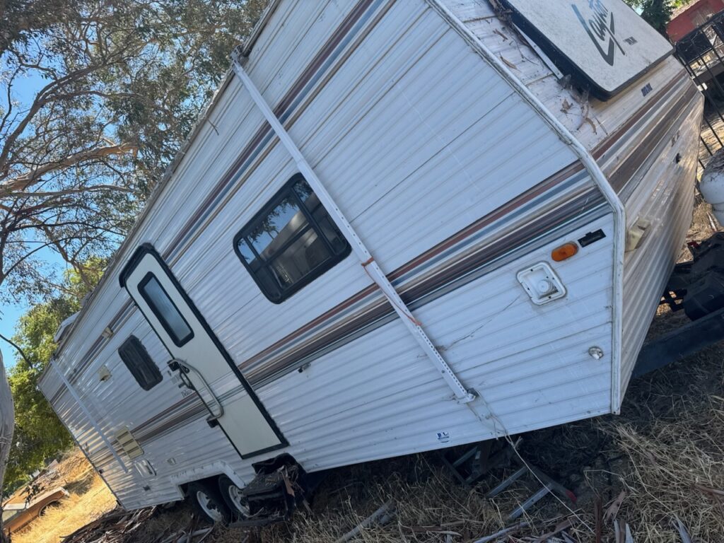 Travel Trailer Hauling to Dump Landfill